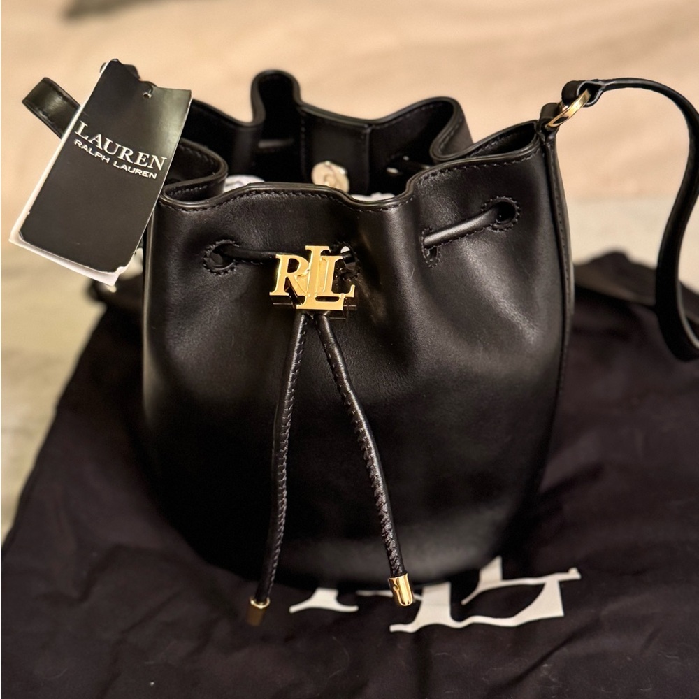 Small sized bag; 11-3/4"W x 8-1/4"H x 5-3/4"D 
20"L adjustable strap